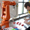 Ellis works with robots